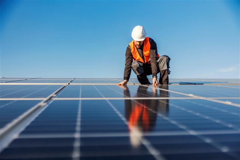 A photo of crew installing commercial solar panels